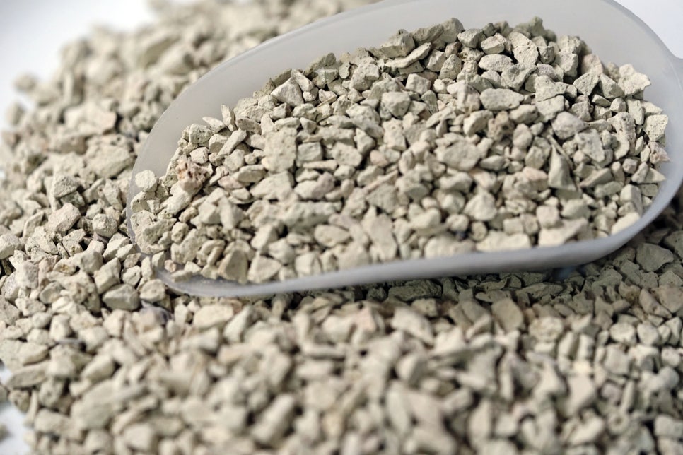 Realistic photo of global market context for filtration media with a clear view of zeolite beads and