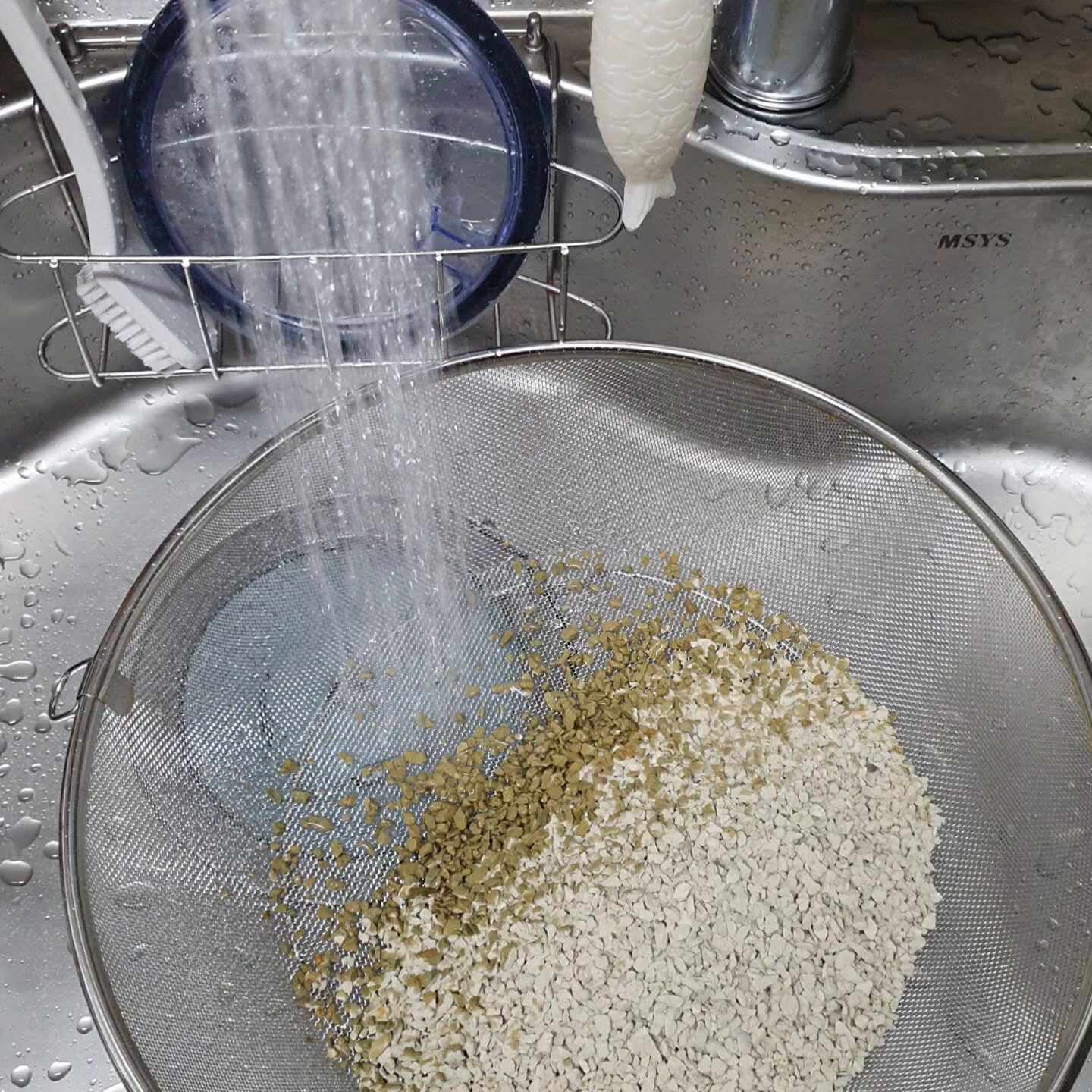 Realistic photo inside a fish hatchery showing water tanks with visible sensors and a technician adj