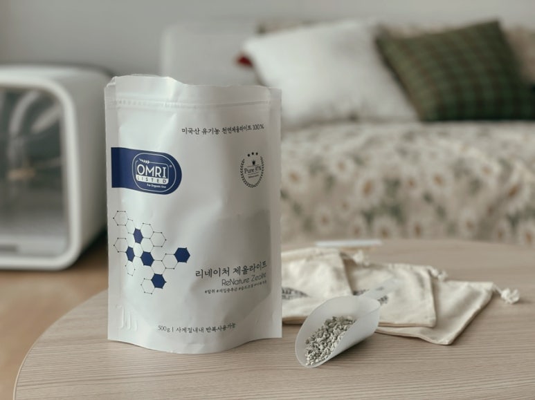 Cozy living room corner with several zeolite sachets placed discreetly around to suggest odor contro