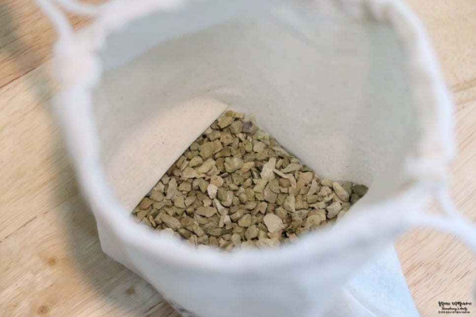 Shoe closet or entryway with multiple pairs and sachets tucked in shelves, warm indoor lighting, rea