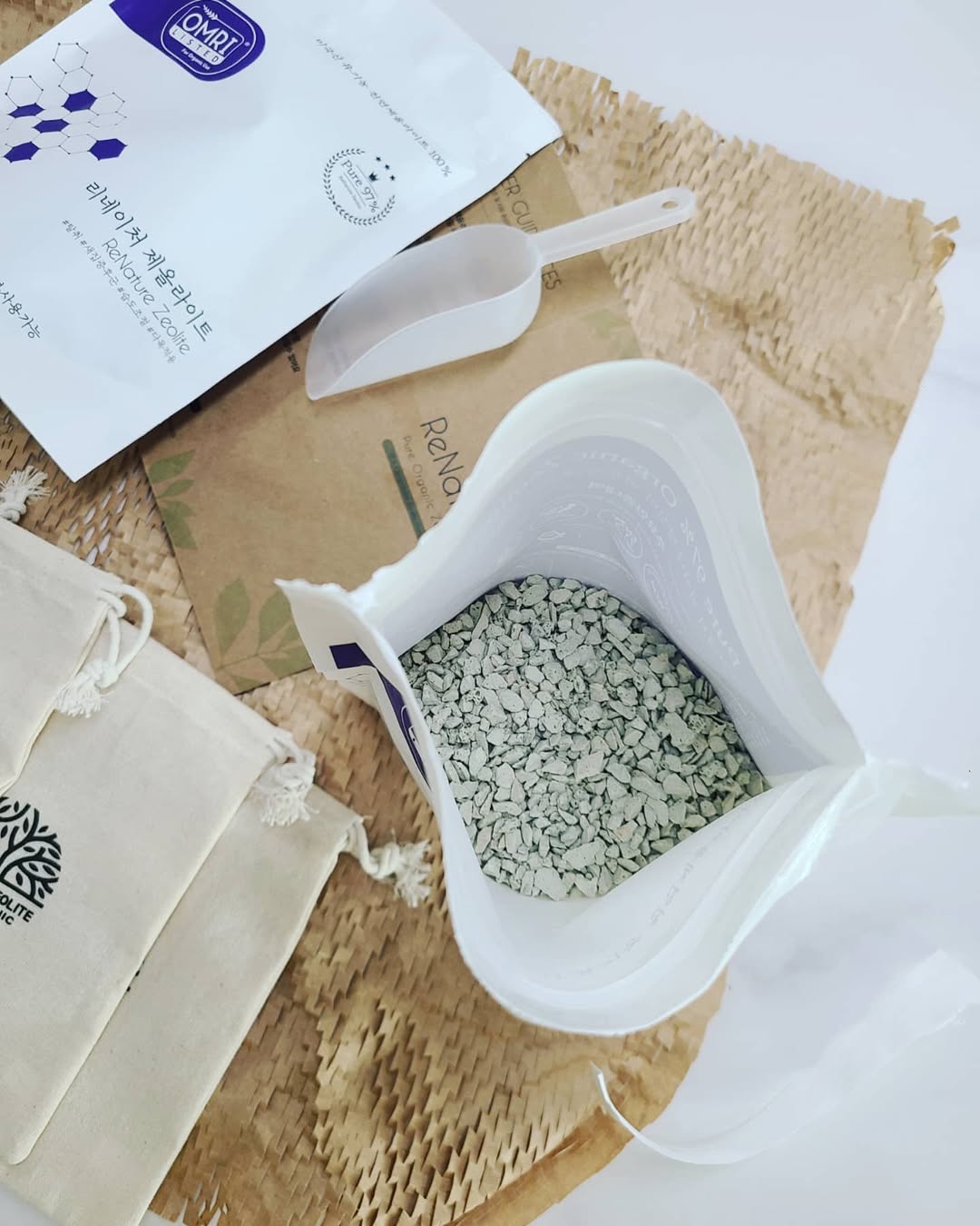 On-site water treatment at a reservoir with workers operating pipes and adding zeolite to water unde