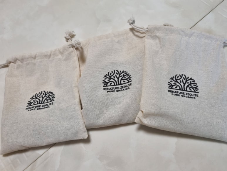 Store display of natural deodorant bottles with minimalist, label-free packaging on a clean shelf.