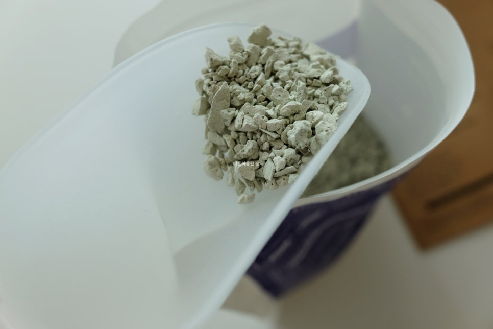 Poultry or small ruminant operation showing precise feed dosing with a scale and powder being added