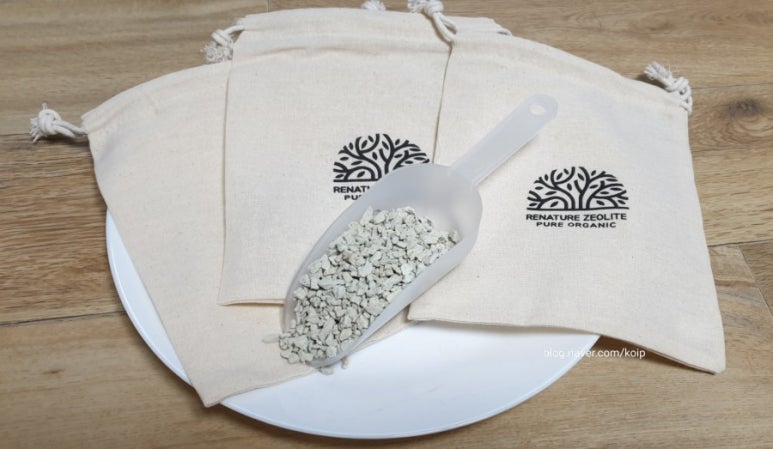 Kitchen counter setup with three clear jars or sachets representing zeolite, activated carbon, and b